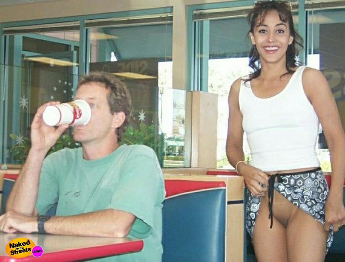 Latina chick flashes her Pussy at a fast food restaur