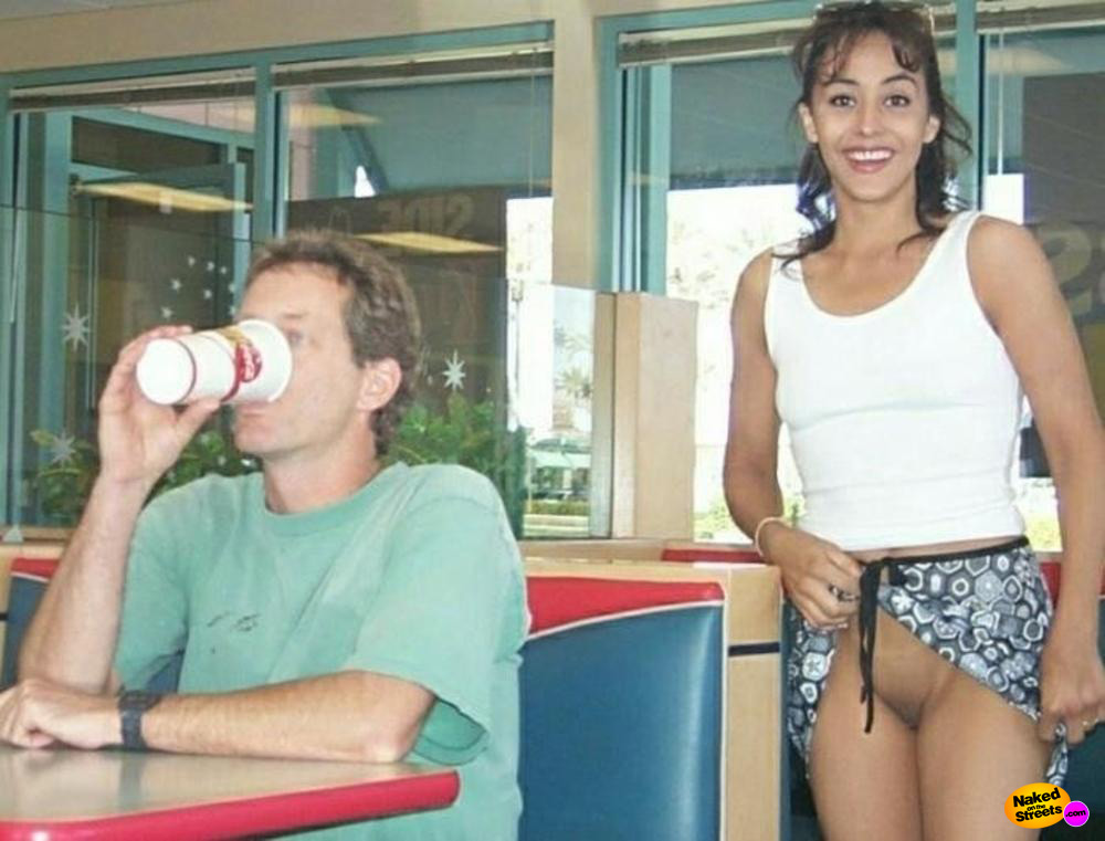 Laughing Latina shows her snatch in a fast food restaur