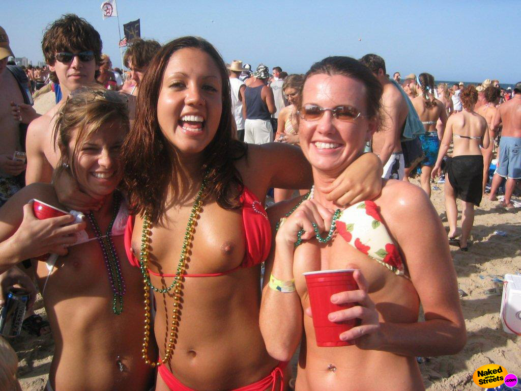 Crazy drunk college whores flashing their titties at a Spring Break celebration image photo